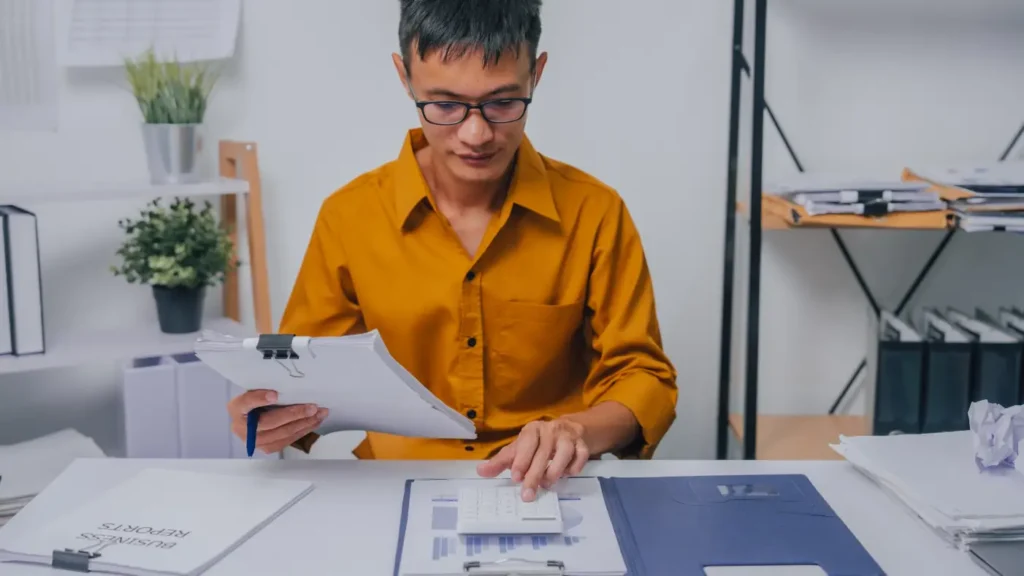 Professional reviewing financial records as part of tax services in Singapore