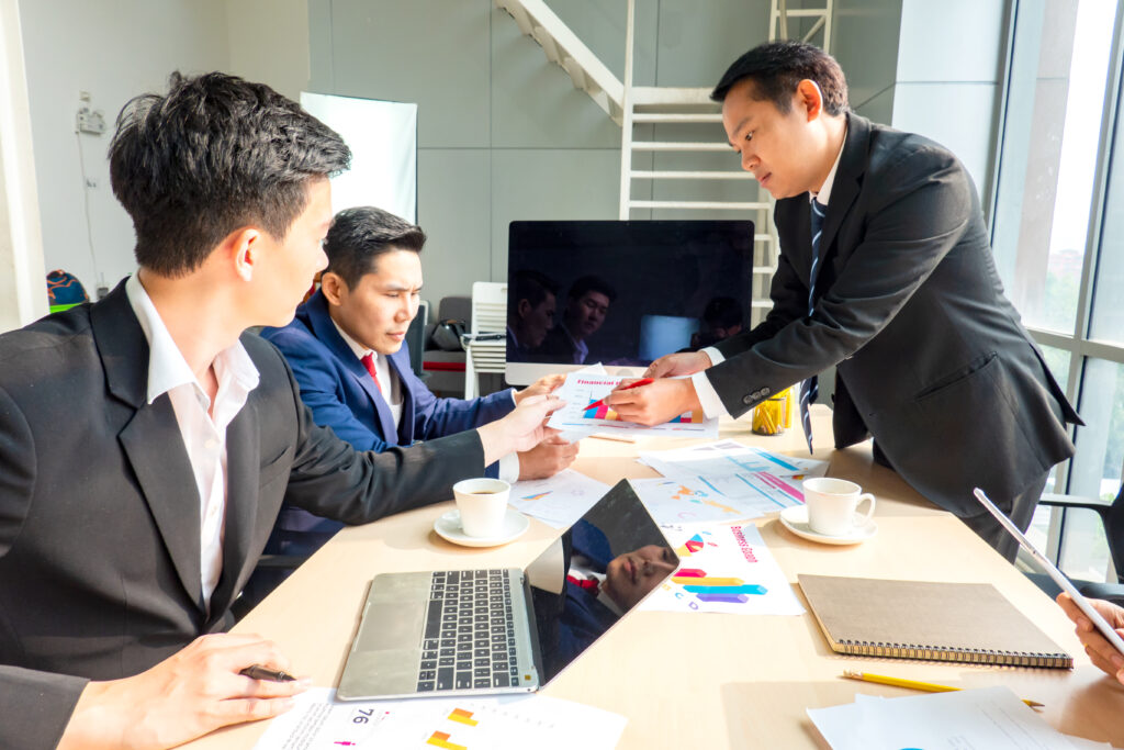 Business team reviewing financial reports as part of a concierge service business plan and operational planning process