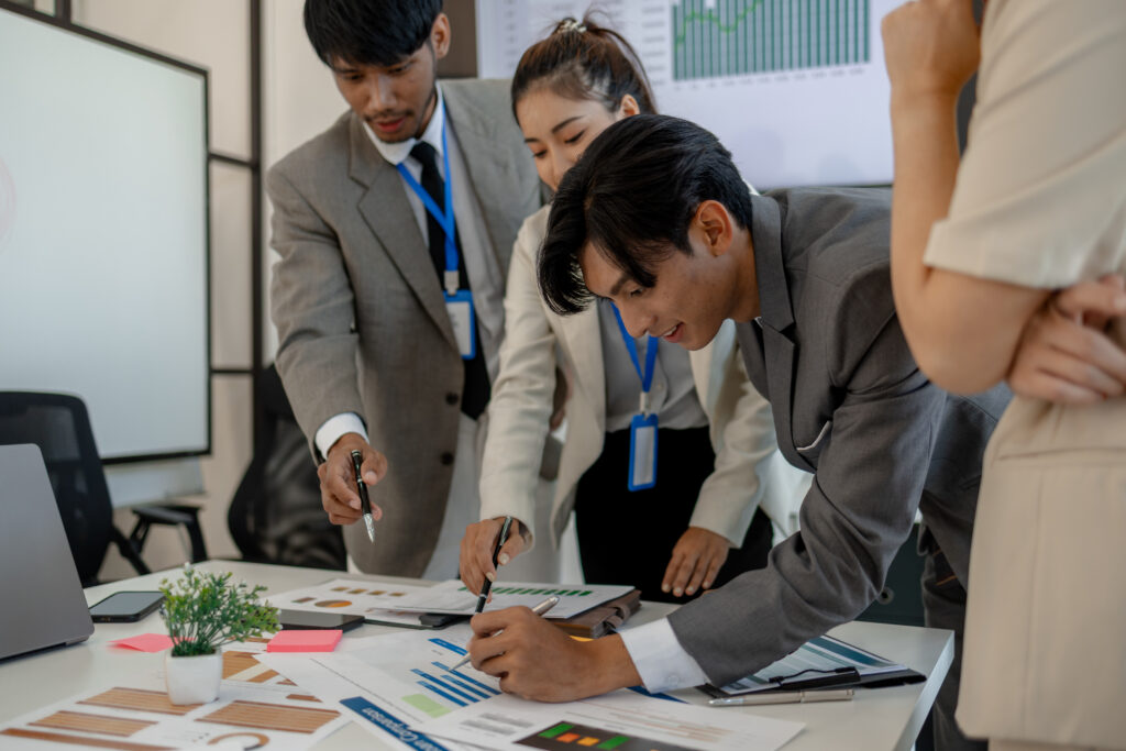 Team analysing business data and strategy as part of a concierge service business plan development process