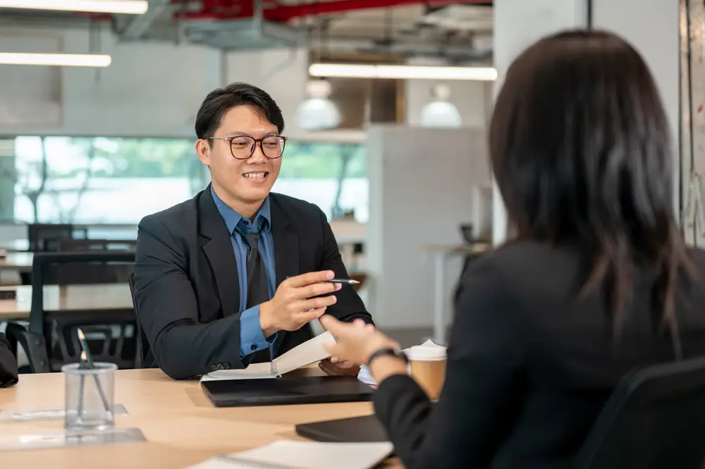 Business consultation showing how to hire an accountant for taxes with professional discussing financial needs with client