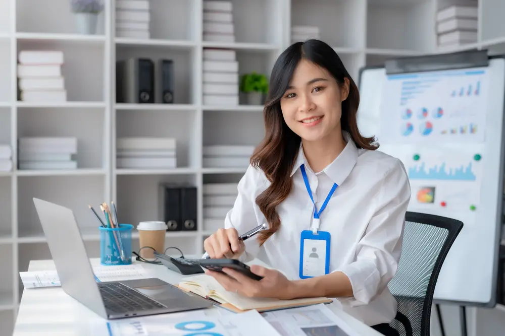 How to hire an accountant for taxes concept with professional reviewing financial data and using calculator in office